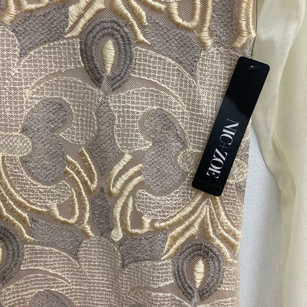 This is a champagne colored blouse by Nic+Zoe. brand new condition with tag.
